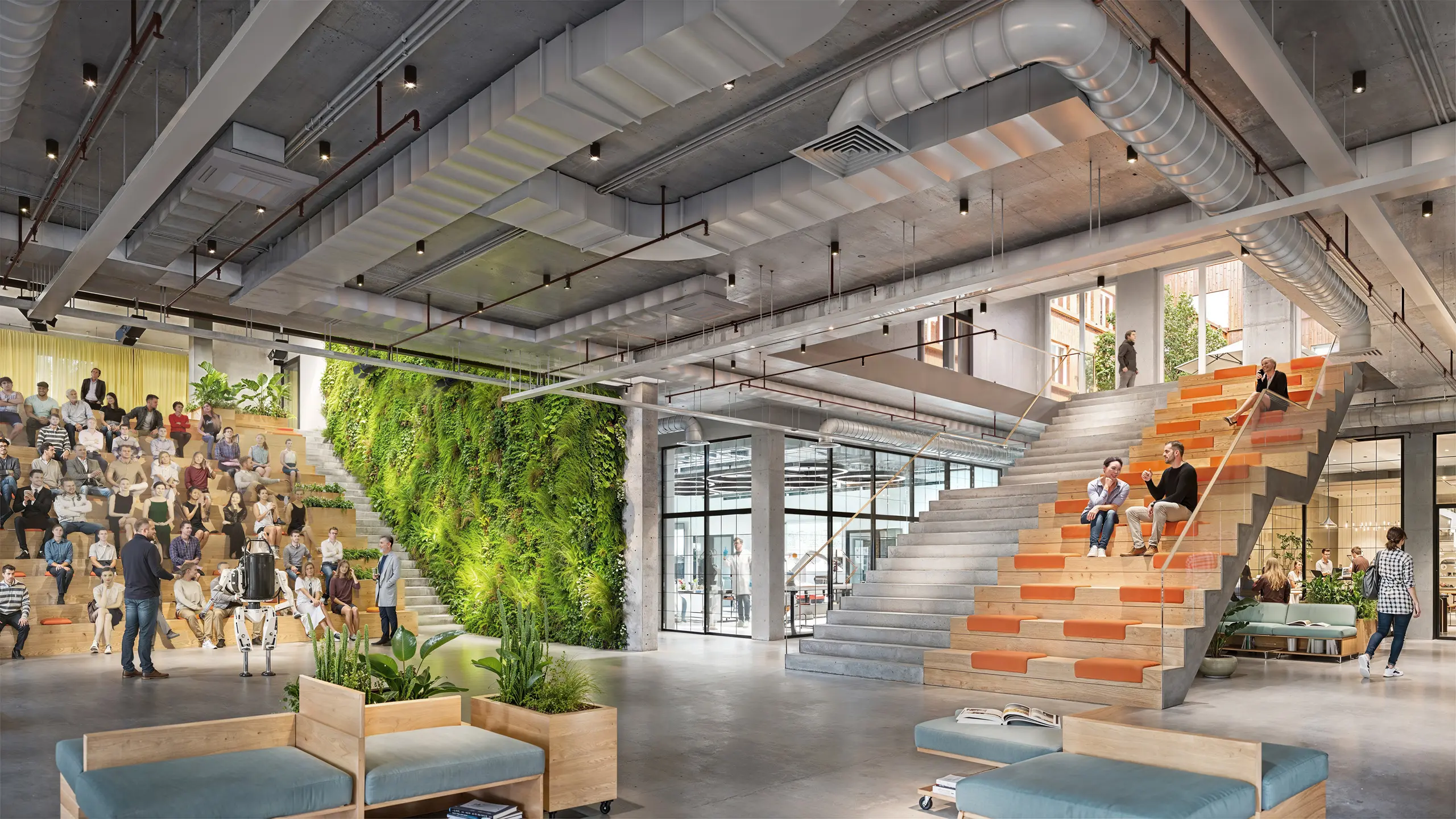 TechFactory Garbsen Auditorium 2045 – großes Eventforum mit begrüntem Innenraum, Tribünenlandschaft und moderner, offener Architektur.